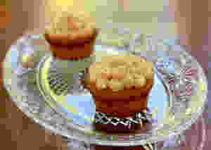 Finished cupcakes on a pressed glass dish