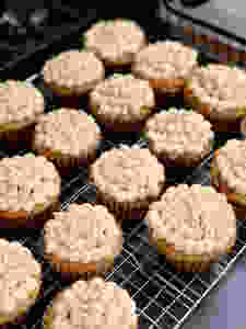 Decorated cupcakes on a wire rack