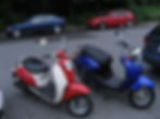 parked red and blue scooters