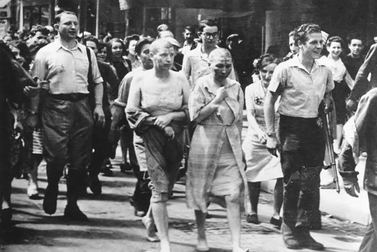 French woman, thought to have collaborated with German soldiers, have their heads shaved. Many were beaten, stripped and paraded. 1944