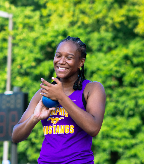 Uzoamaka Iwuj, Memphis Mustangs, is smiling at shot put practice