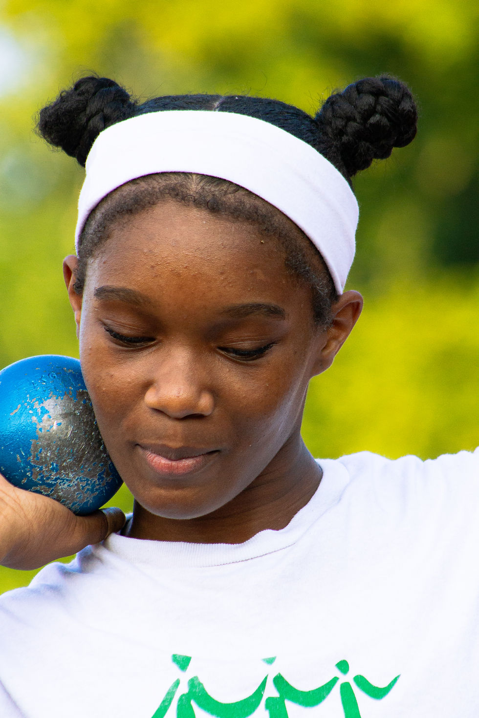 Memphis Mustangs athlete preparing to throw a shot put.