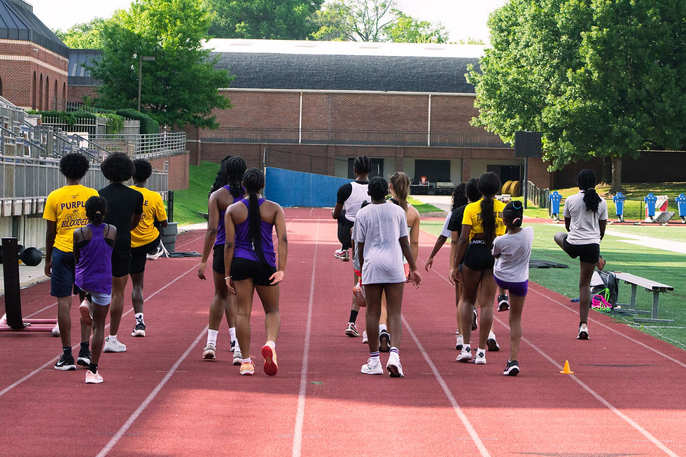 Memphis Mustangs track team training on a running track.