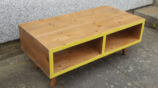 Handmade wooden coffee table with yellow trim and storage
