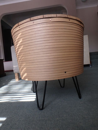 contemporary table with pilchard barrel design