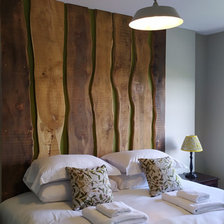 bespoke timber feature wall bed headboard with natural curves design