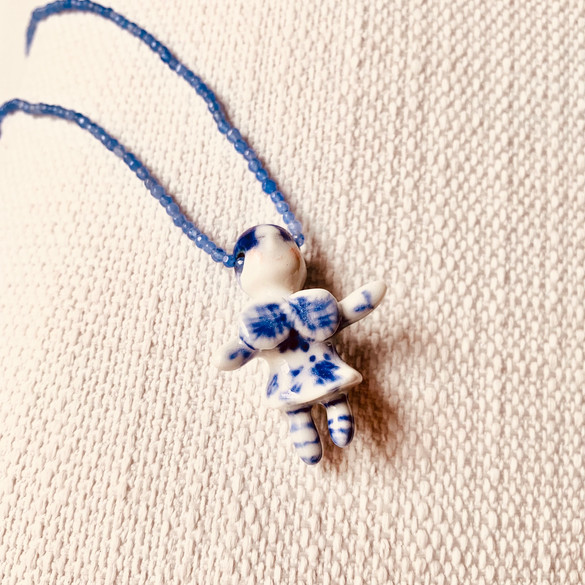 Inner child pendant by Lilú Escobar