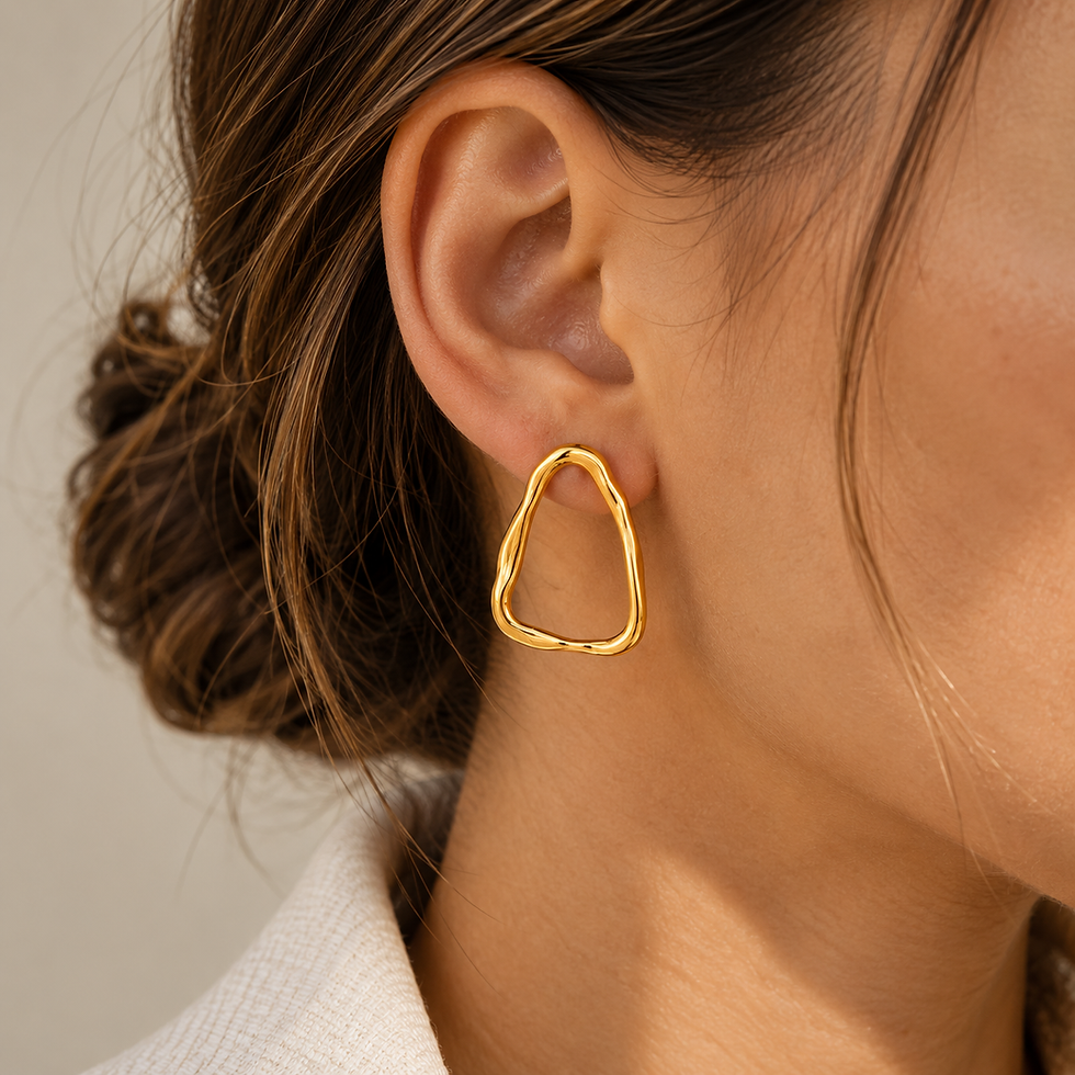 Thumbnail: Woman wearing Essential Gold Hoop Earrings in a side profile