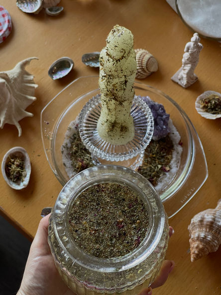 a haling spell and spiritual cologne with figure candle