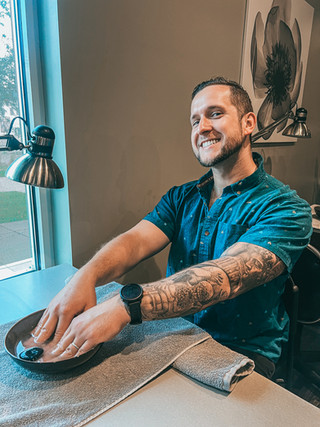 a man getting a manicure at a spa