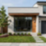 Exterior of a renovated modern home with wood accents and new landscaping