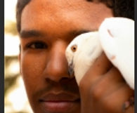 Black man holding a bird Willie Mason.jpeg