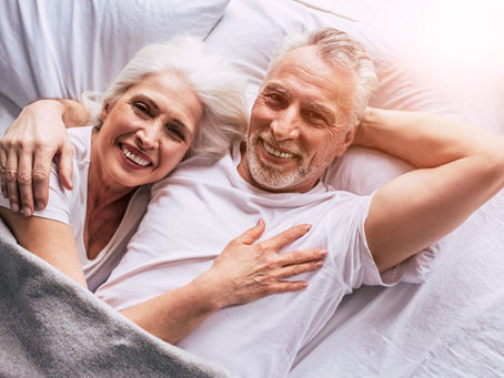 Midlife couple on bed