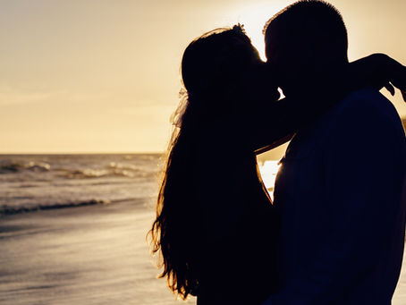 An artistic, moody silhouette that represents deep intimacy and passion without showing explicit detail.