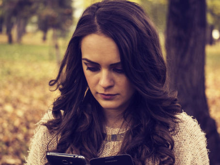 A women looking at a phone