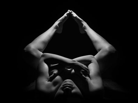 Lady doing a naked yoga pose