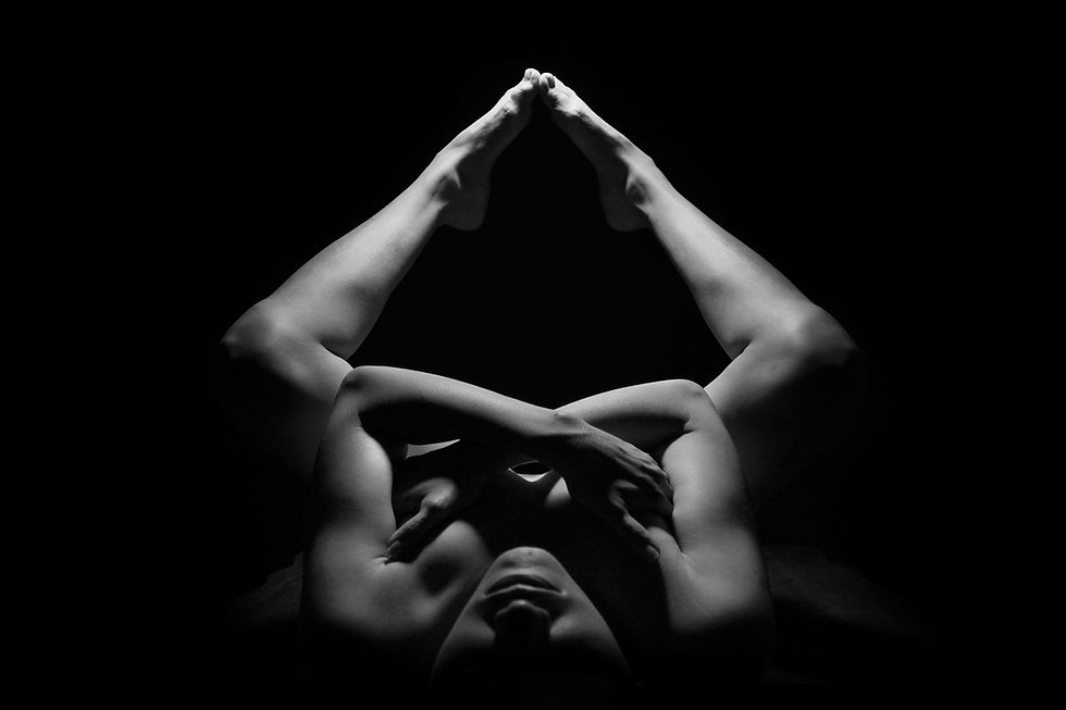 Lady doing a naked yoga pose