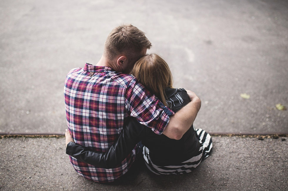 Deeper emotional support. One partner has their head resting gently on the other's shoulder.