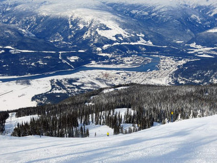 Skiing a groomer at Revelstoke overlooking the town
