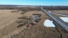 Two draglines and and a wide channel of water.