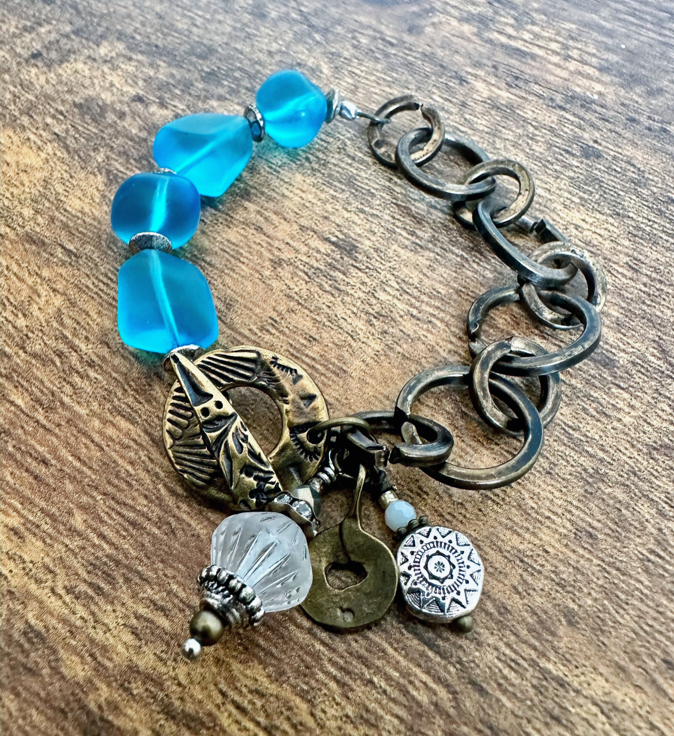 Antique rustic bronze chain and aqua beach glass bead and charm bracelet