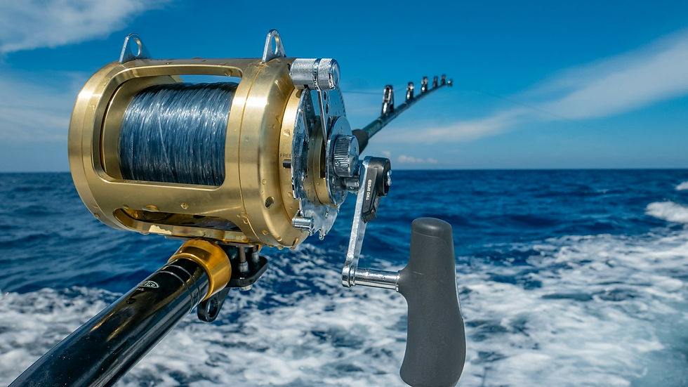 Offshore trolling reel on a sportfishing boat running across blue Atlantic water