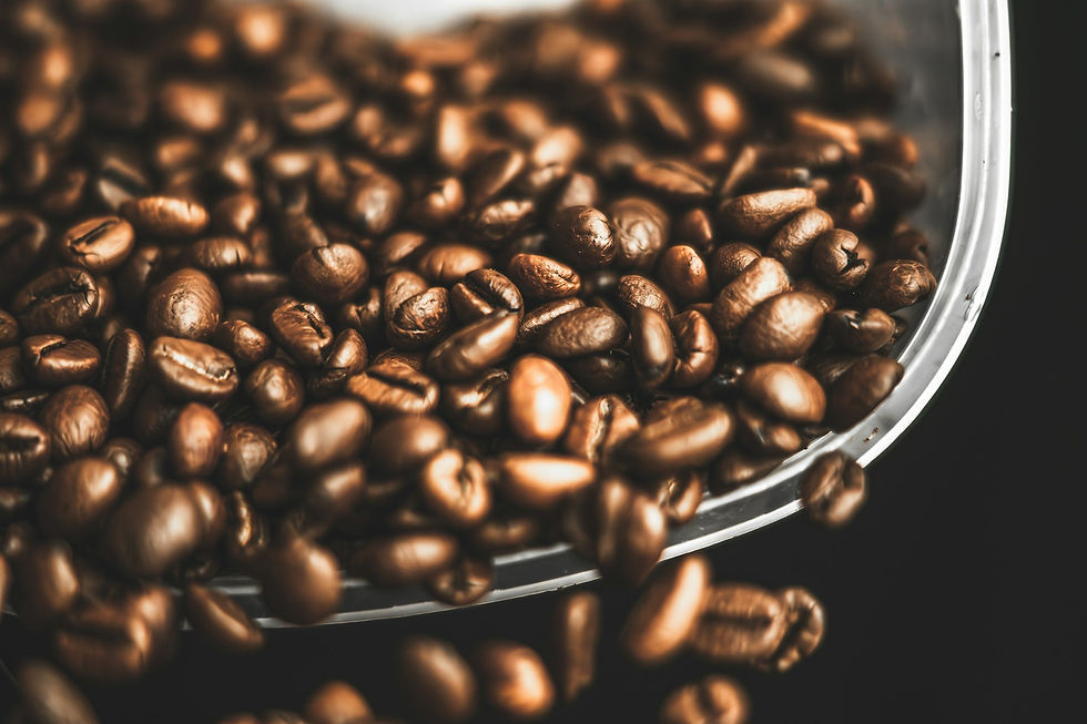 A close up of a bowl of coffee beans
