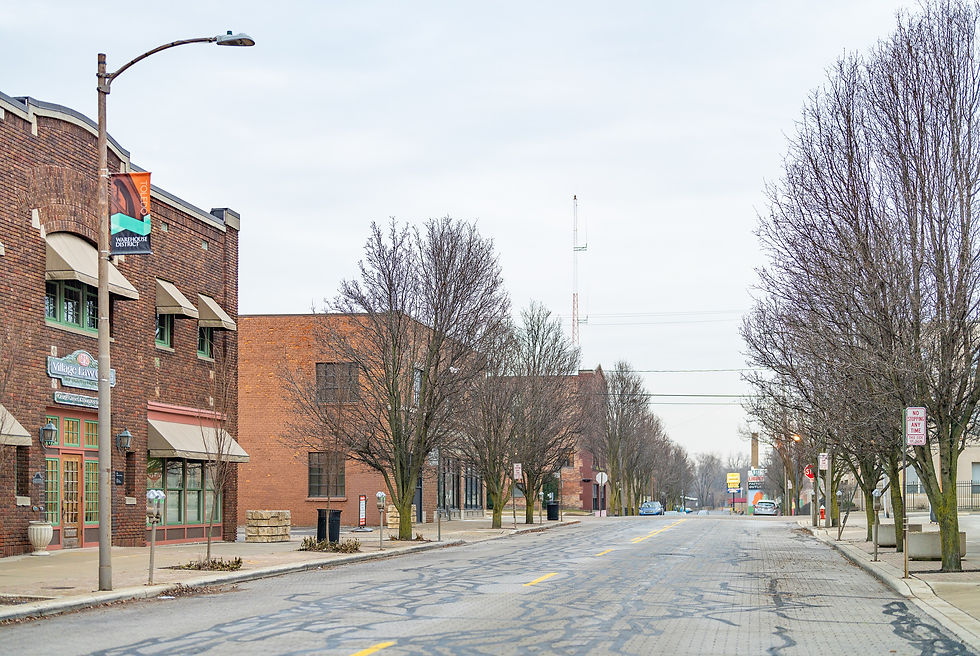 Brick buildings and bare trees along Huron Street in the Toledo Warehouse District