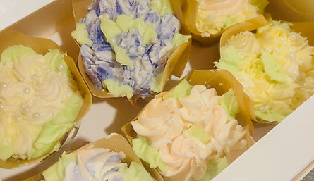 Cupcakes neatly arranged in a box.