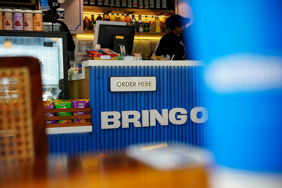 Cafe counter with bringo and order here signs