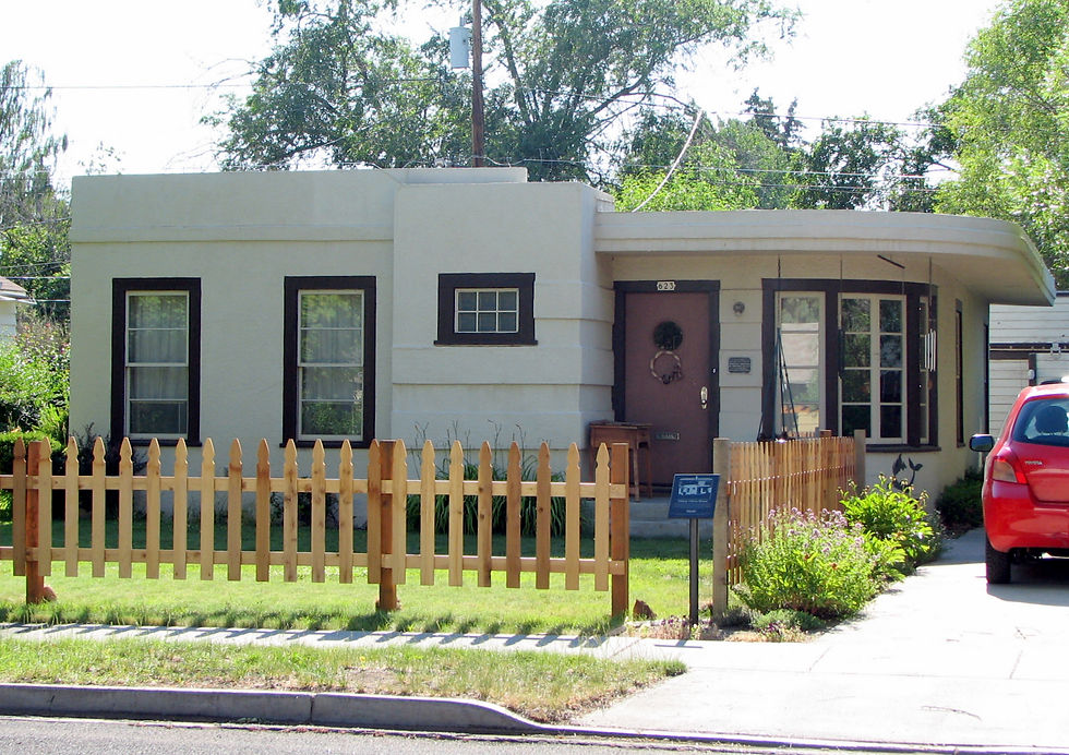 Historic streamline moderne house with picket fence on a residential street in Redmond, Oregon
