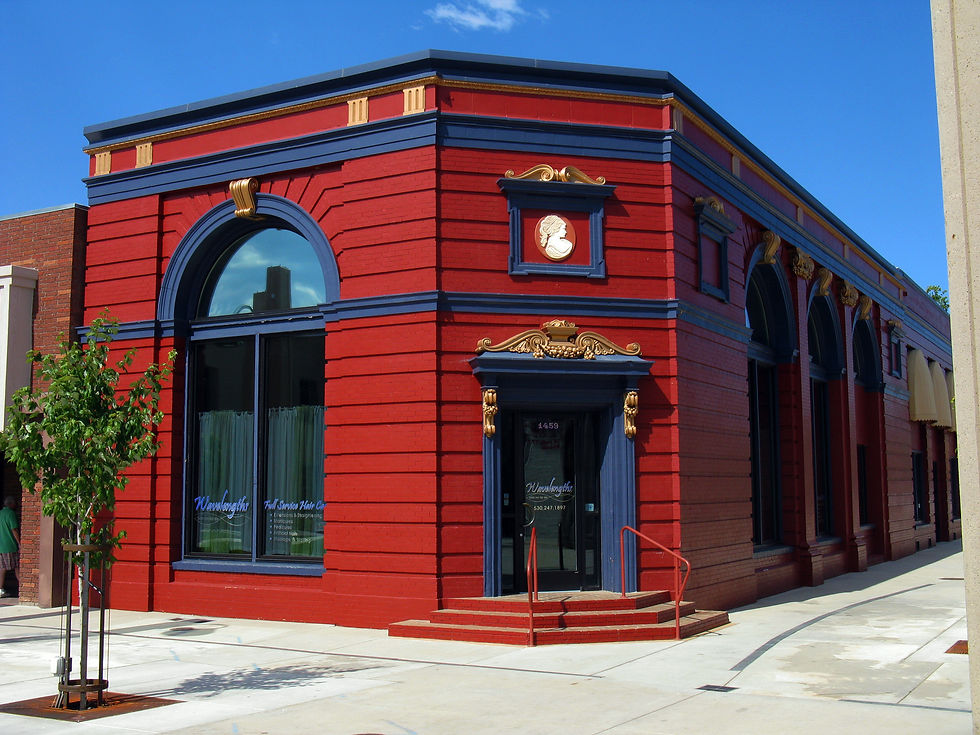 Historic red and blue 1901 Shasta County Bank building on a downtown Redding California corner