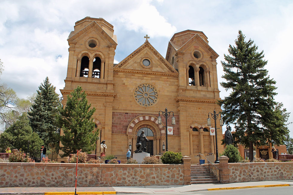 The Cathedral Basilica of St. Francis of Assisi framed by trees in downtown Santa Fe
