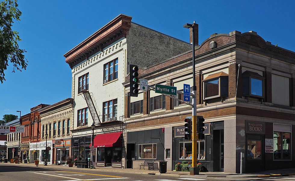 A street-level view of downtown Stillwater, Minnesota near Main and Myrtle Streets, lined with the boutique shops of the city's historic antiquing district