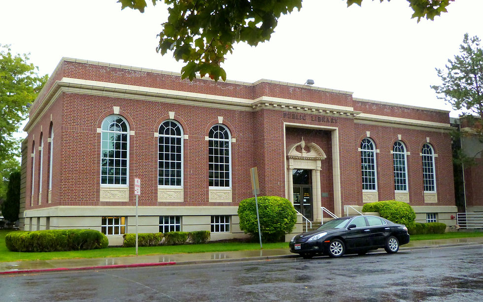 Red brick historic wing of the Twin Falls Public Library with arched windows in Idaho
