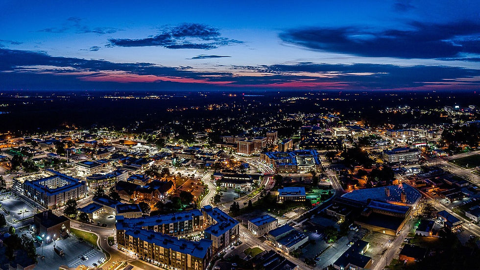 Greenville NC downtown aerial at dusk — city lights, no people as subject