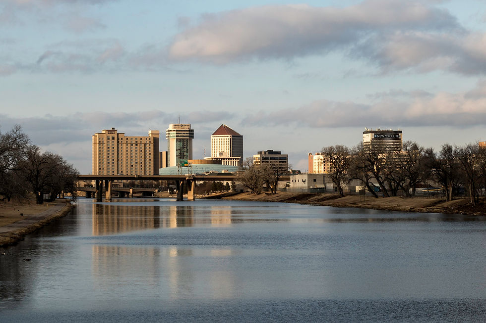 Downtown Wichita skyline reflected in the Arkansas River seen from the Lincoln Street Bridge