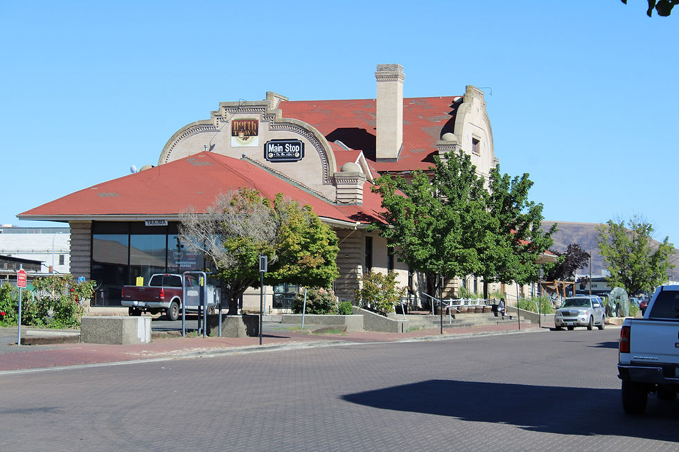 Mission Revival Northern Pacific passenger depot with red tile roof in downtown Yakima Washington