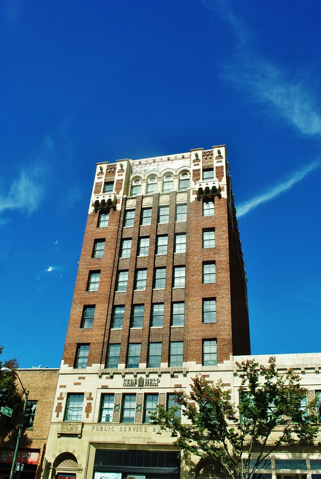 Public Service Building brick tower against a blue Asheville sky