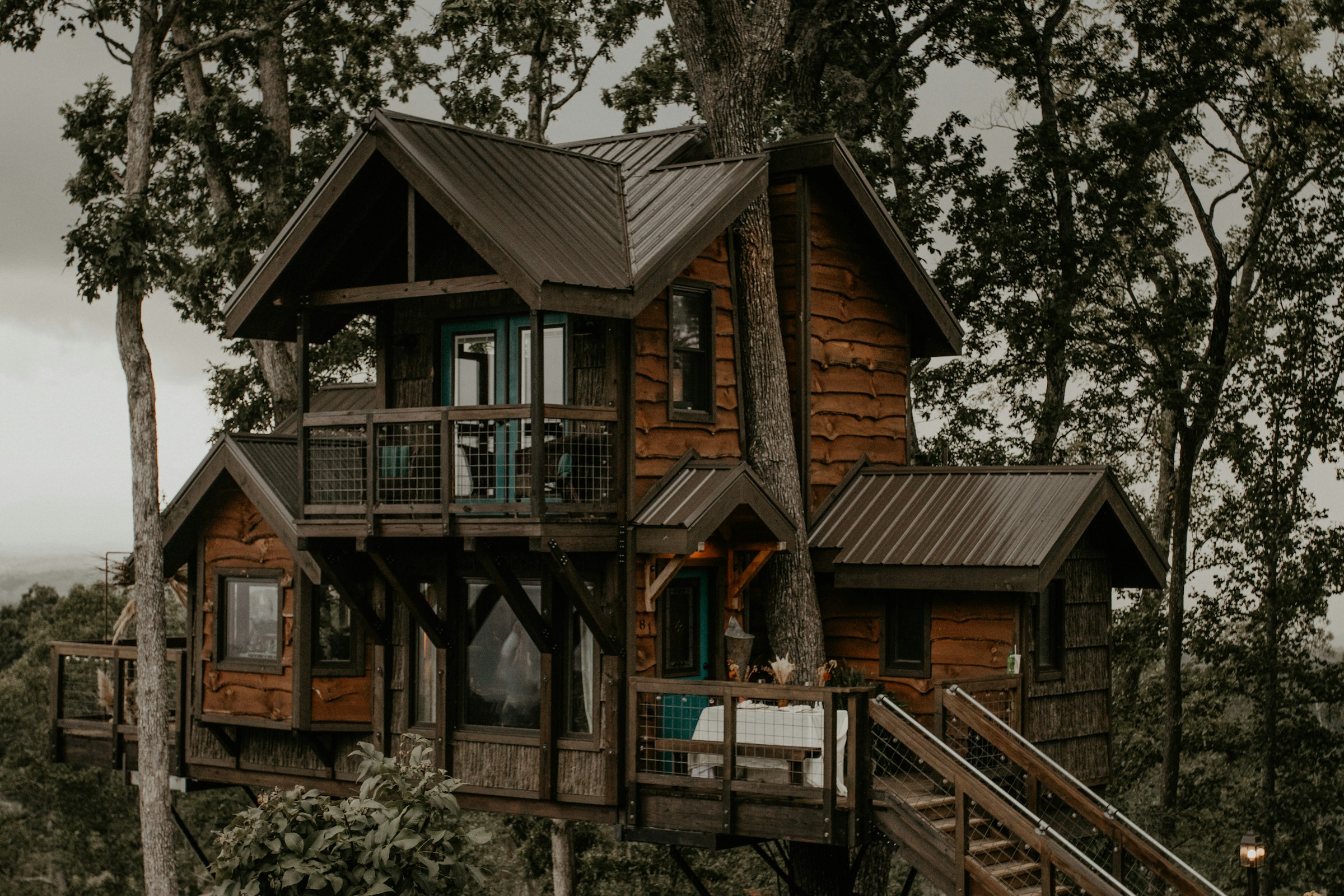 Wooden house surrounded by trees near Asheville, North Carolina, representing an independently owned short-term rental property