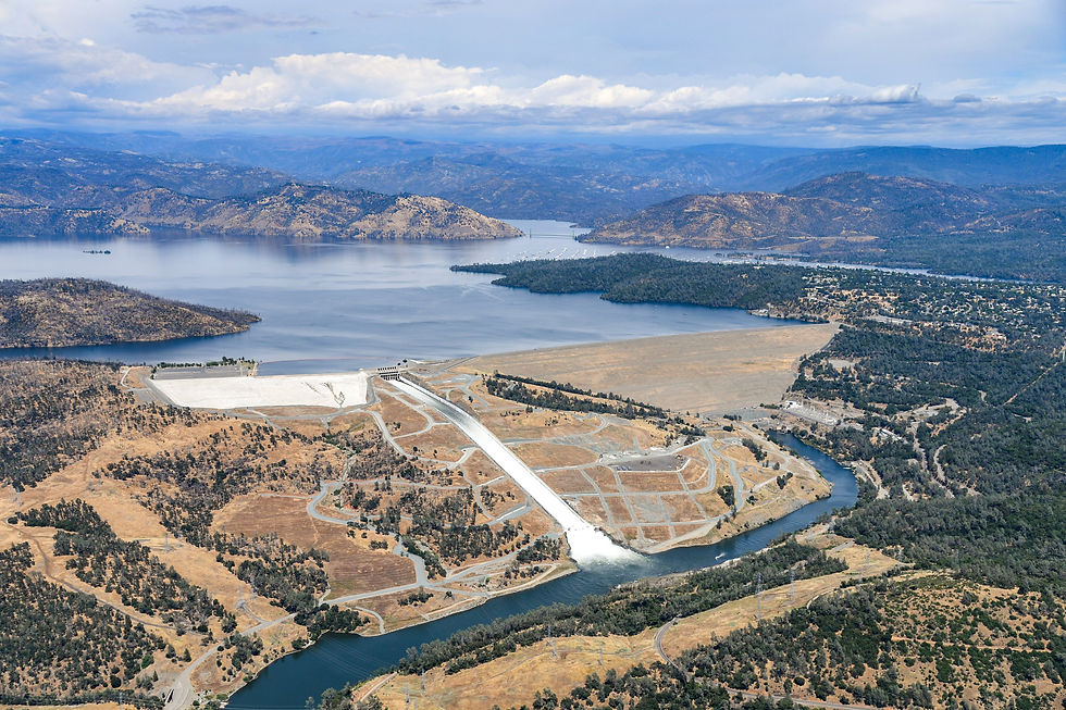 Aerial view of Oroville Dam, its spillway and a full Lake Oroville above the Feather River