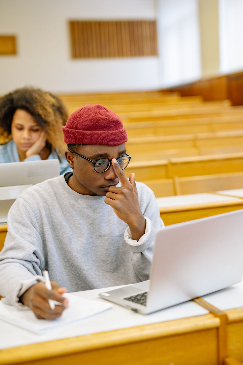 Students with laptops in a lecture hall