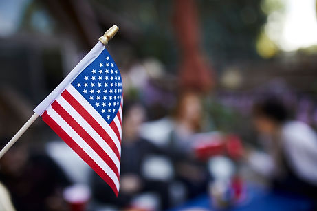 blurry-people-celebrating-with-american-flag.jpg