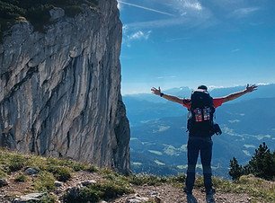 hiker-with-backpack-arms-outstretched-on-trail-in-germany