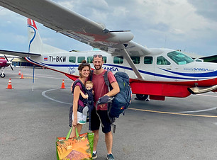 meravos-family-boarding-plane-with-baby-carrier-travel-tips.jpeg