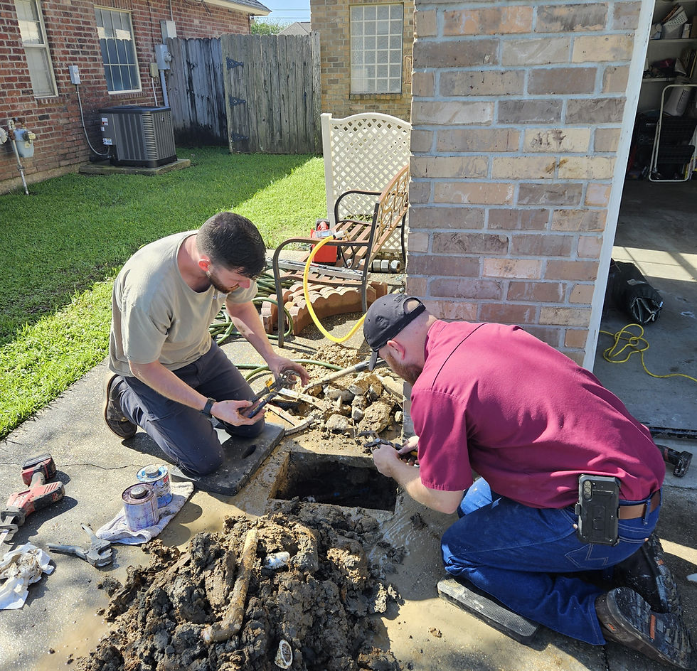 Eye-level view of a plumber fixing a kitchen sink in a residential home