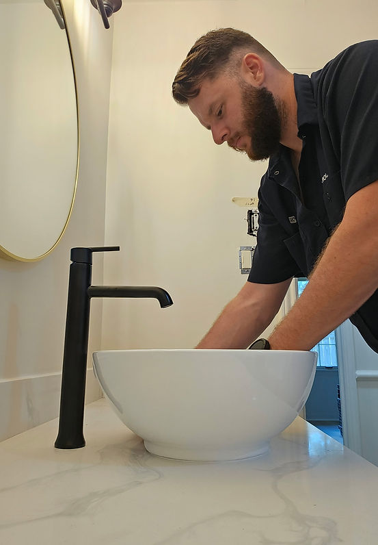 plumber installing a sink