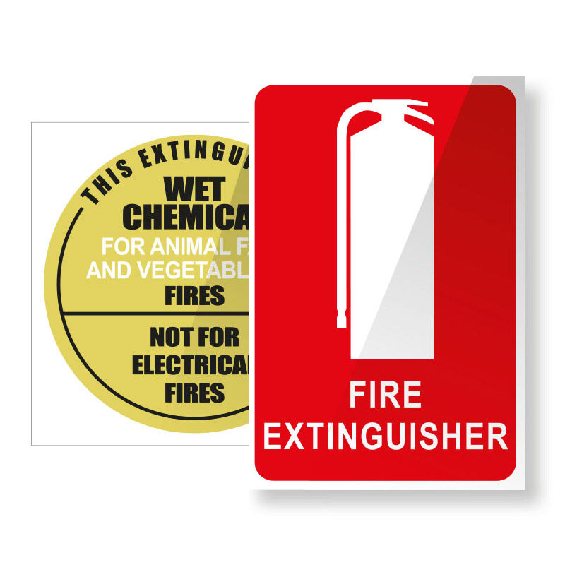 Red fire extinguisher sign beside a yellow label reading wet chemical for animal and vegetable fires, not for electrical fires.