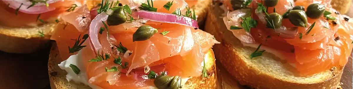 Smoked salmon crostini with capers and herbs