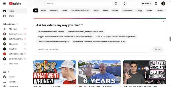 Pagina iniziale di YouTube con un pannello BETA "Chiedi i video come preferisci", barra di ricerca e miniature video colorate su un'interfaccia bianca.